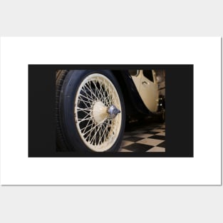 Old spoke wheel of vintage car in cream colour Posters and Art